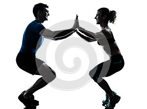 Man woman exercising squatts workout fitness