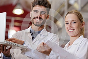 man and woman experts making tests in wine manufactory