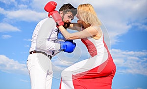 Man and woman fight boxing gloves sky background. Attack is best defence. Couple in love boxing. Women can fight back