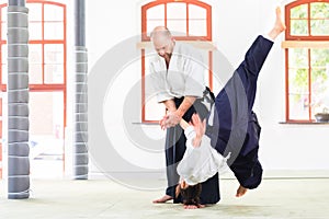 Man and woman fighting at Aikido martial arts school