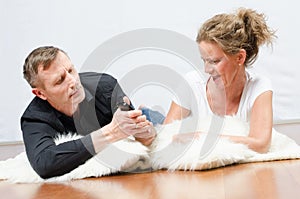 Man and woman fighting for TV remote control