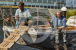 Man and woman on fishing boat in dock