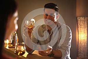 Man and woman flirting with each other in bar photo