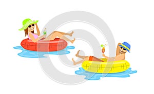 Man and woman floating on inflatable inner rings, mattress, tubes