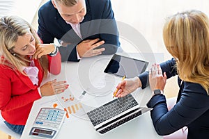 Man and woman getting help from professional financial consultant photo