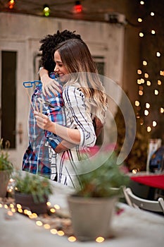 Man and woman greet each other with hug