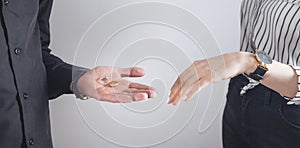 Man and woman hands with engagement rings