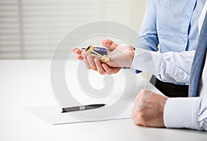 Man and woman hands holding keys from a new house