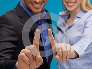 Man and woman hands pointing at something