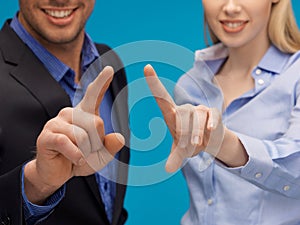 Man and woman hands pointing at something