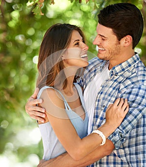 Man, woman and happy with hug in forest for bonding, connection and love in Canada. Couple, smile and summer on date