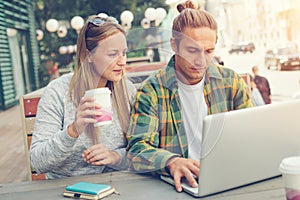 Man and woman have meeting in cafe, young business ideas