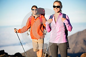 Man and woman hiking on beautiful mountain trail