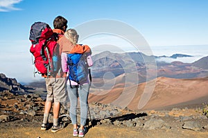 Man and woman hiking on beautiful mountain trail