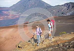 Man and woman hiking on beautiful mountain trail