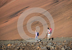 Man and woman hiking on beautiful mountain trail