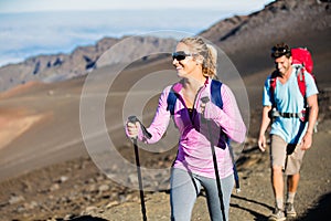 Man and woman hiking on beautiful mountain trail