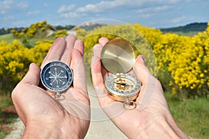 Man and woman holding compasses