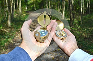 Man and woman holding compasses