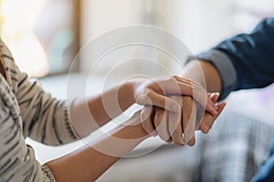 A man and a woman holding each other hands