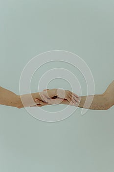 Human hands on a light background. the concept of unity, friendship and love