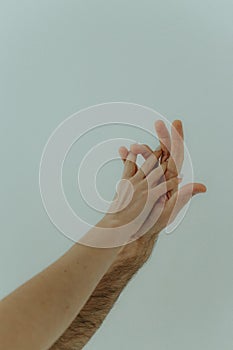 Human hands on a light background. the concept of unity, friendship and love