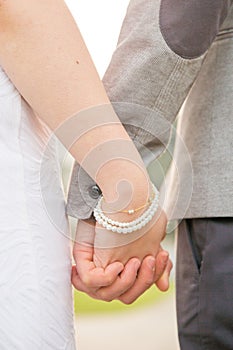 Man and Woman Holding Hands in Outdoors Park