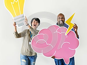 Man and woman holding light bulb and pink cloud icons