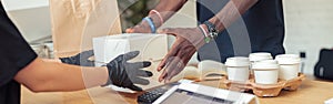 Man and woman holding for white box photo