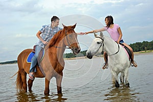 Man and a woman on horseback