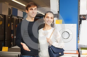 Man and woman at household appliances section