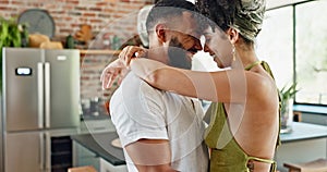 Man, woman and hug for dancing in kitchen with bonding, connection and love with laugh in morning at house. Dancer