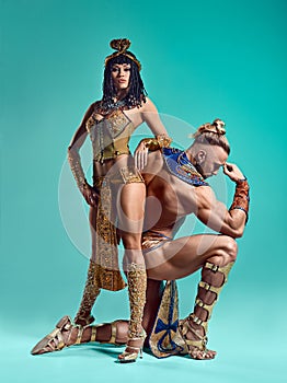 The man, woman in the images of Egyptian Pharaoh and Cleopatra