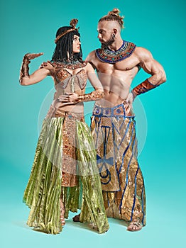 The man, woman in the images of Egyptian Pharaoh and Cleopatra photo