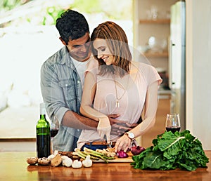 Man, woman and ingredients for recipe, together and chopping with relationship and love in kitchen. Couple, home and