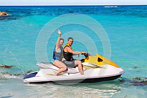 Man and woman on a jet ski photo