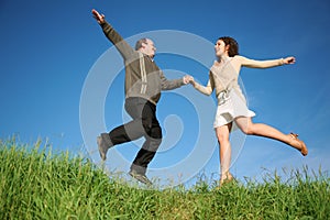 Man and woman jumping