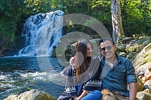 Man and woman in la monja waterfalls on xico veracruz Travel Concept photo