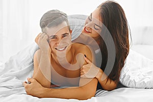 Man and woman in love in bed