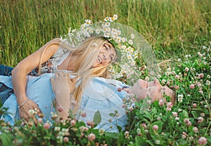 Man and a woman lying down on grass.
