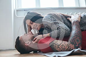 Man and woman lying on the floor