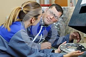 man and woman mechanics twork