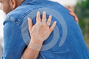 Man and woman mother and son hugging each other at home