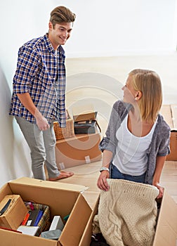 Man, woman and packing boxes for moving to new home or property investment, real estate or mortgage. Couple, happy and