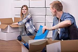 Man and woman packing things