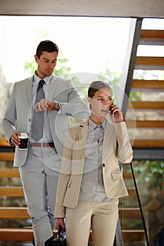 Man, woman and phone call to communicate with company administrator on progress of deal, agreement or negotiation