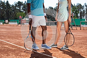 Man and woman are playing sport on court