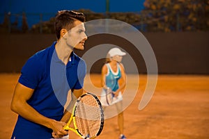 Man and woman playing in tennis