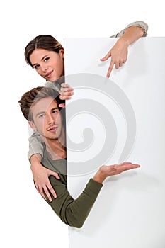 Man and woman pointing