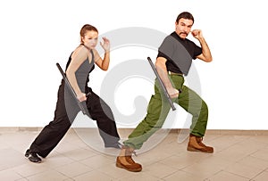 Man and woman practce with truncheon photo